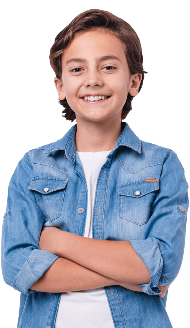 Grade schooler boy smiling with his arms crossed
